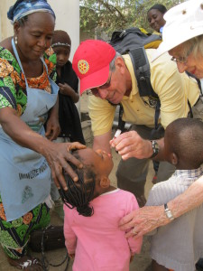 Ken Hughes volunteer giving vaccine