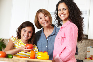 Mother, daughter and grandmother cooking