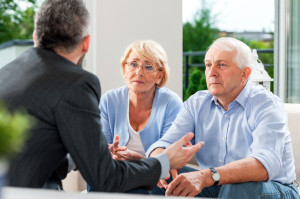 Retiree couple getting financial advice