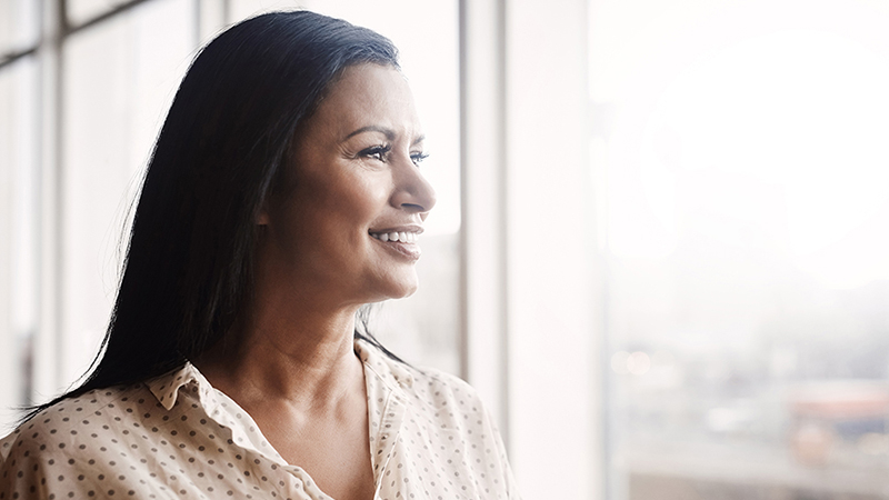 A woman looking out the window of a building