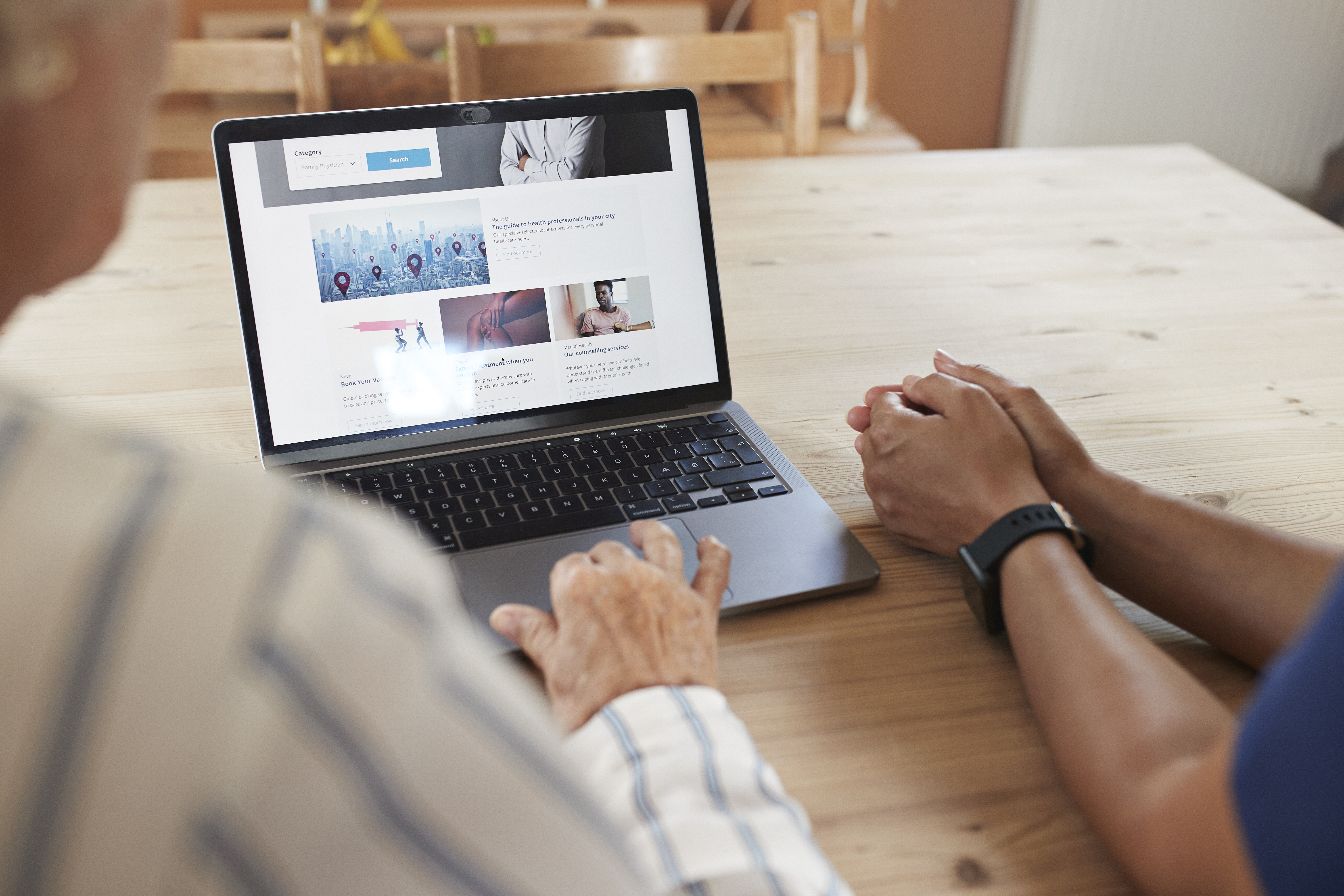 Woman learning to book appointment from caregiver