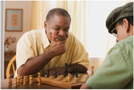 Senior men may require different activities in assisted living facilities-two men play chess