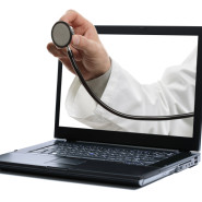 Laptop and doctor with stethoscope