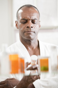 Man holding pill bottle