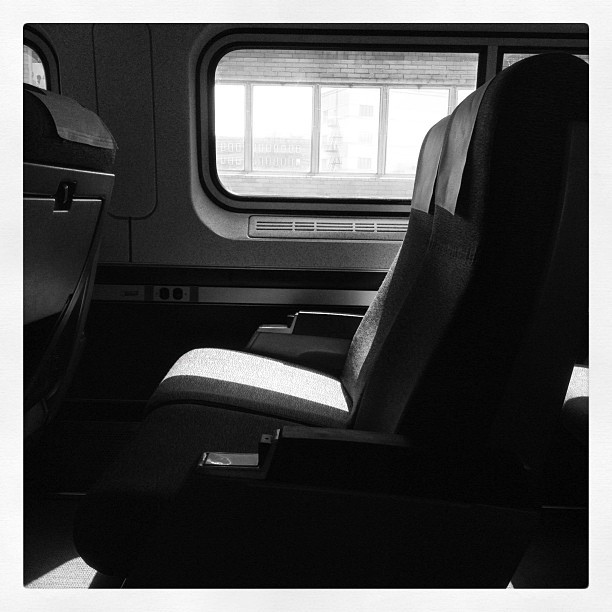 Black and white photo of a seat in the quiet car