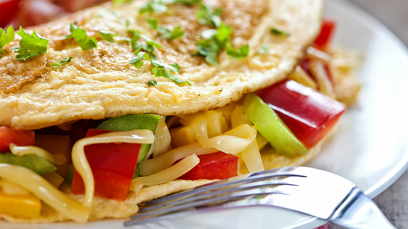 A close-up view of an omelette on a plate