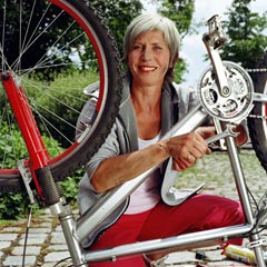 240-woman-fixing-bike-infuriating-fibs-women-over-50