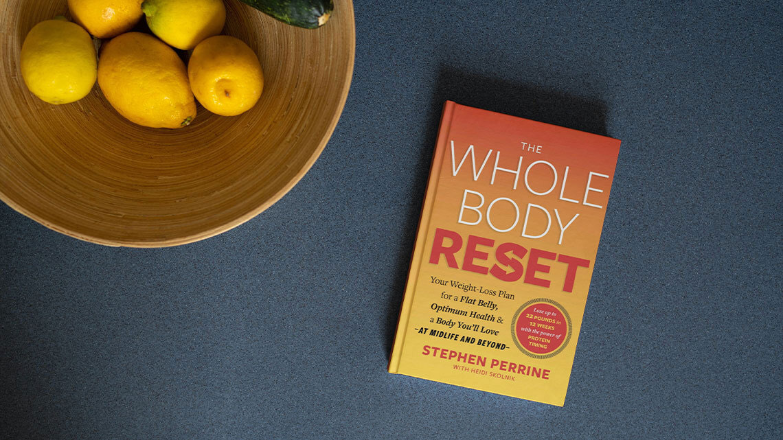 whole body reset book with bowl of lemons