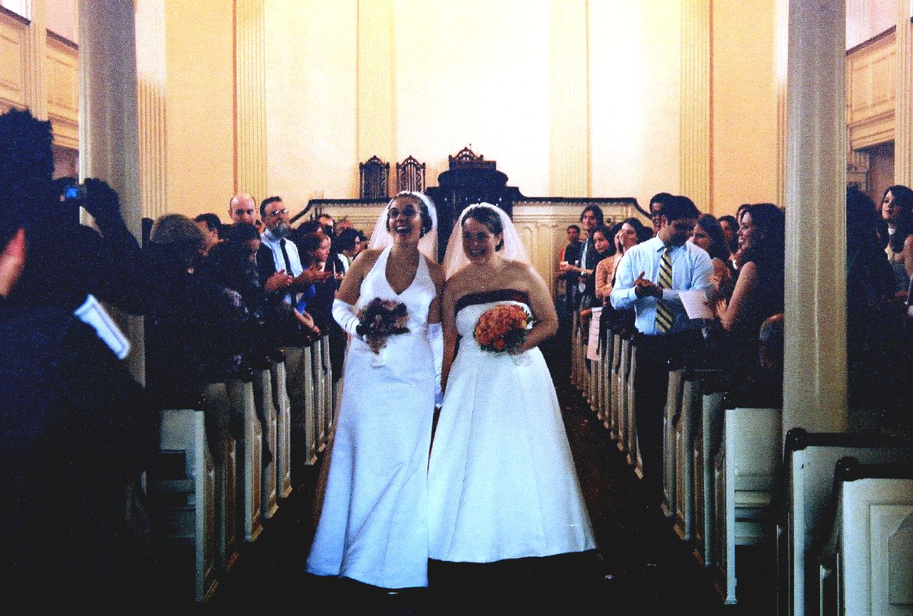 Two women in church getting married, gay marriage