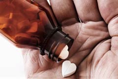 240-heart-shape-pill-bottle-hand