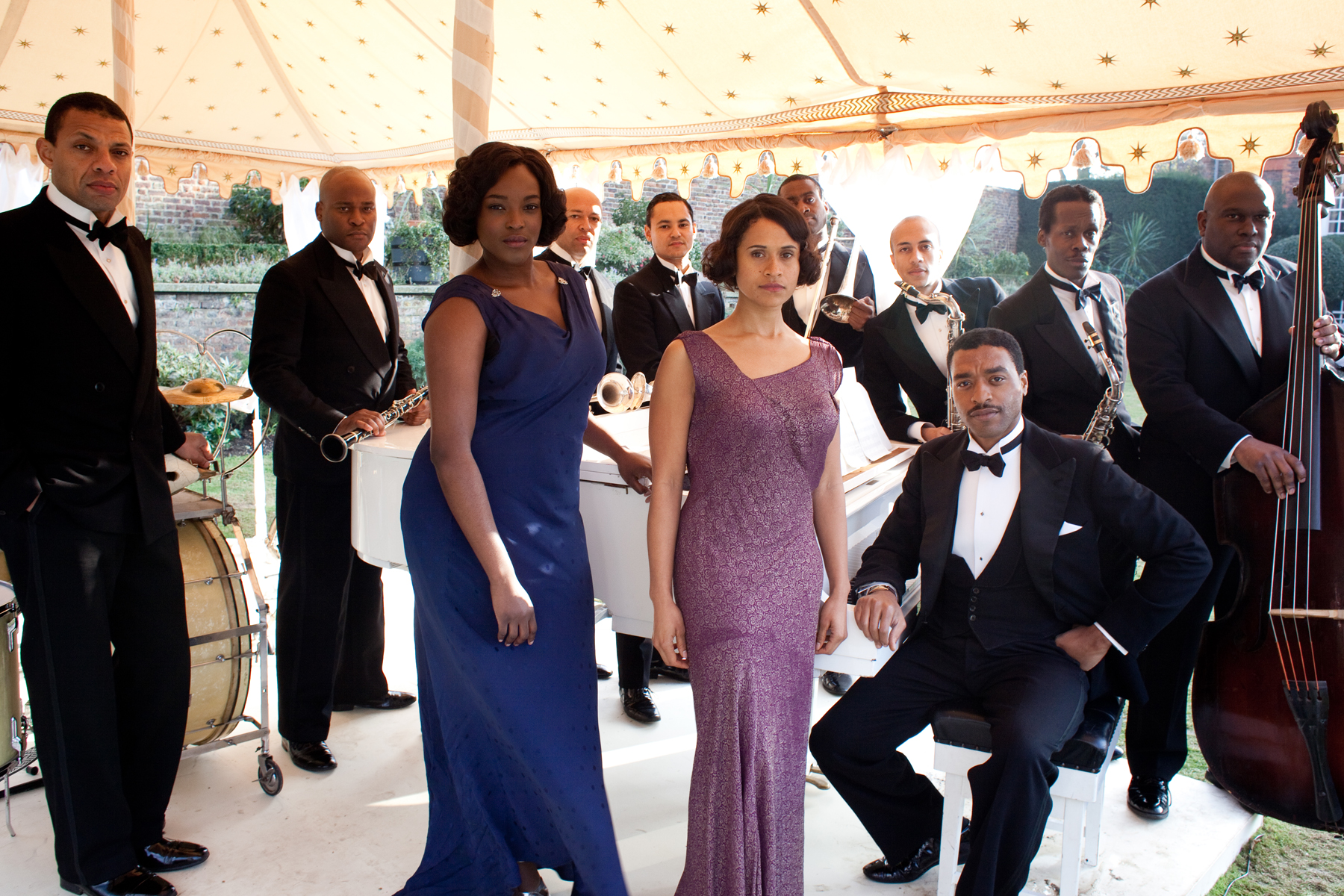 Band members with Carla (Wunmi Mosaku), Jessie (Angel Coulby) and Louis Lester (Chiwetel Ejiofor)