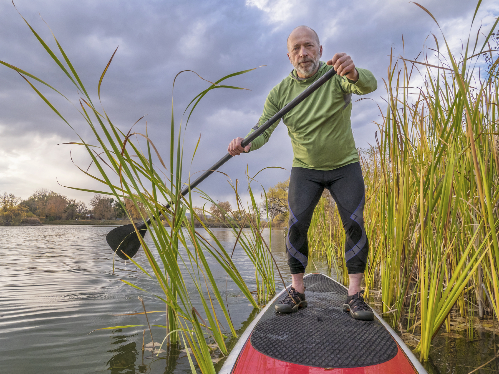 stand up paddling on a lake