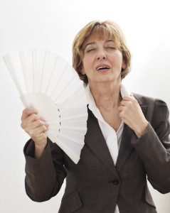 Woman fanning herself