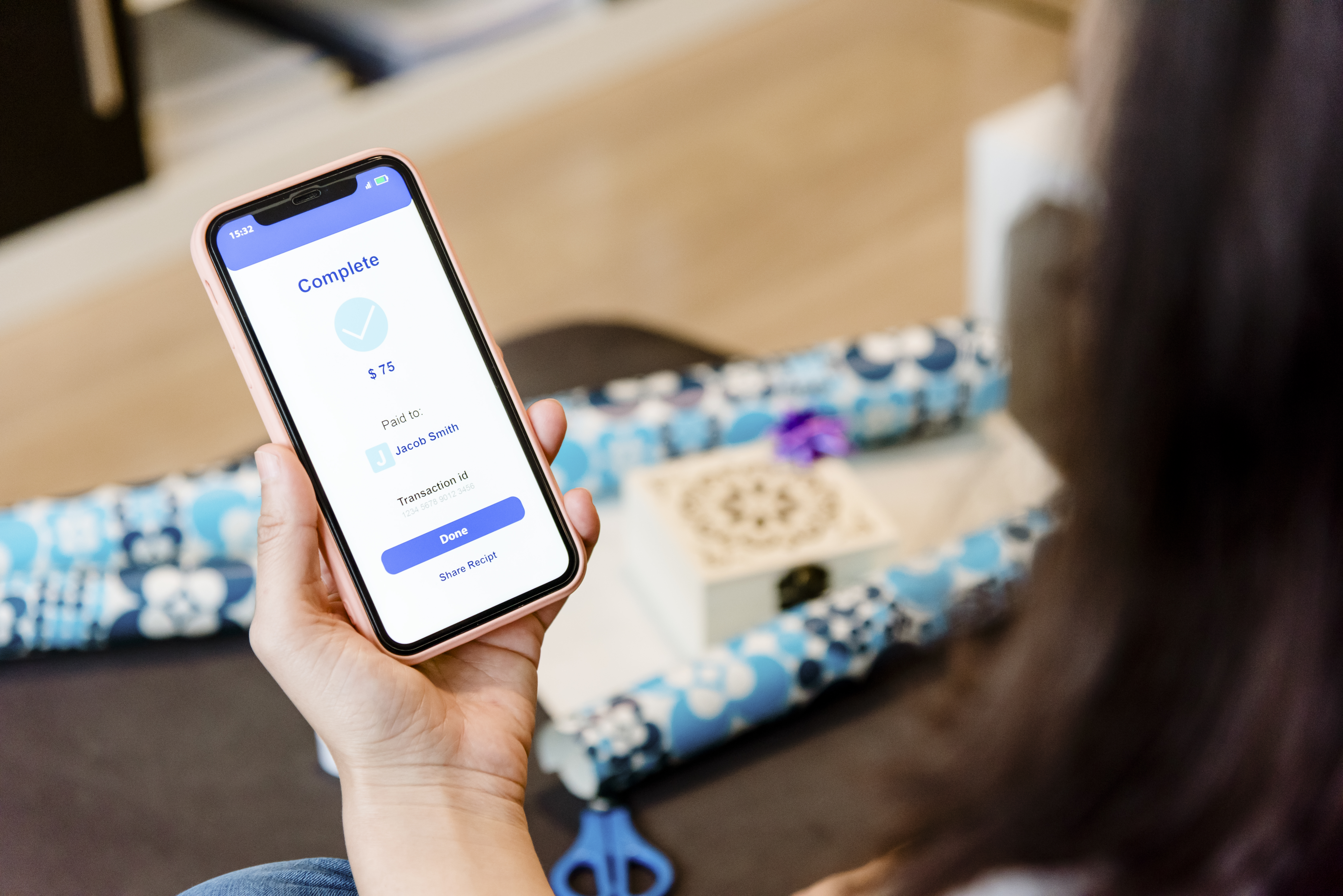 woman sending money to a friend through a mobile phone