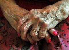 240-senior-person-hands-red-nails