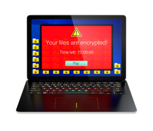 Screen of laptop computer showing alert that the computer was attacked by ransomware. 3D rendering image with clipping path.