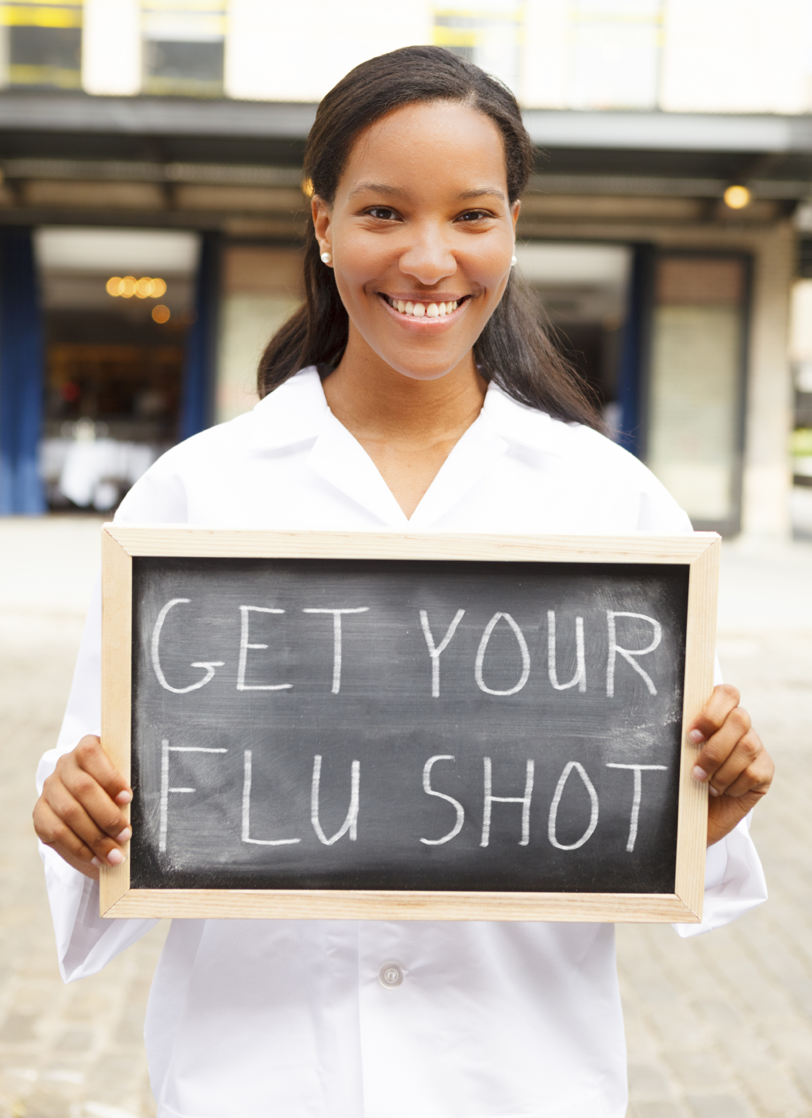 Young Woman with Flu Shot Sign