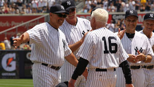 Whitey Ford, right, walks up to Reggie Jackson during The New York Yankees 65th Old Timers Day.