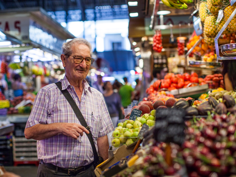 Older man buying groceries