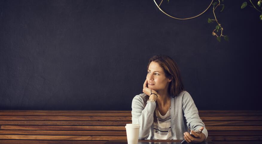 woman sitting alone at coffee shop