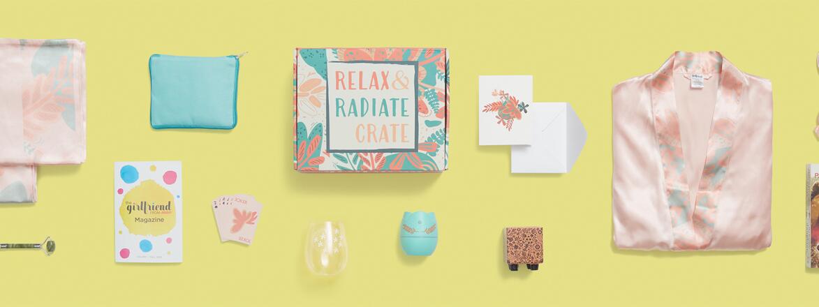 Fall 2020 Relax and Radiate crate contents photographed from above on a yellow background