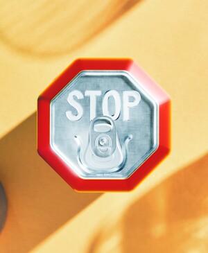 Photo illustration of a soda can shaped as a stop sign