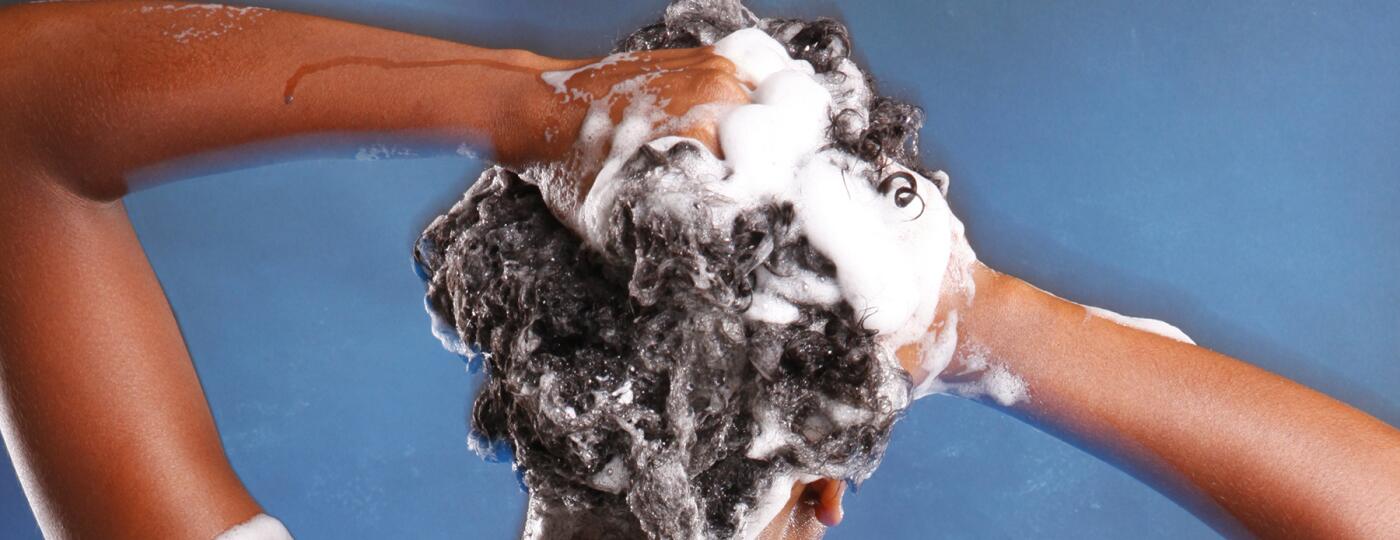 image_of_back_of_woman_washing_hair_shutterstock_57885145_1800