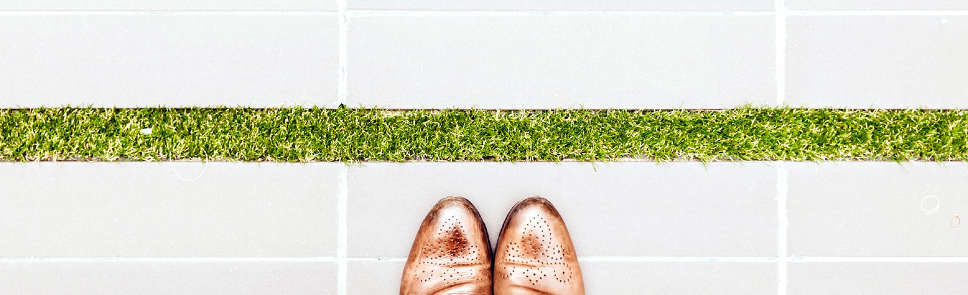 An image of a person's feet in Oxfords.