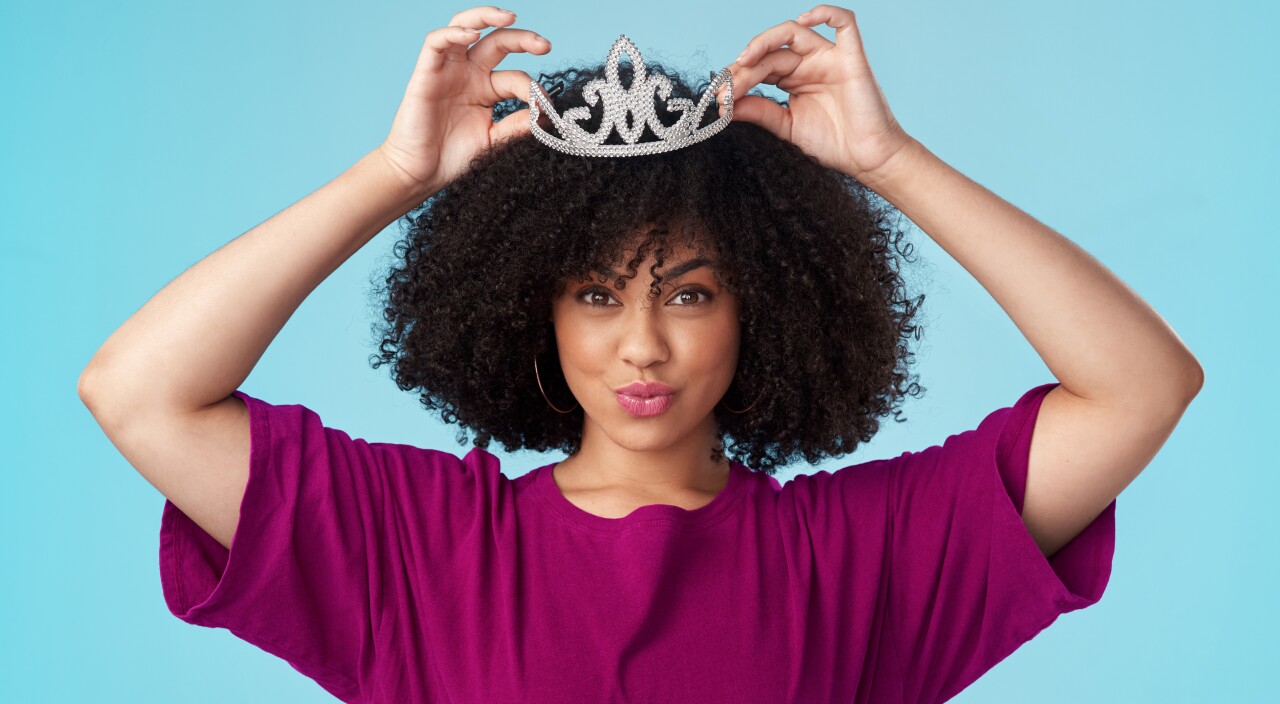 woman adjusting her crown