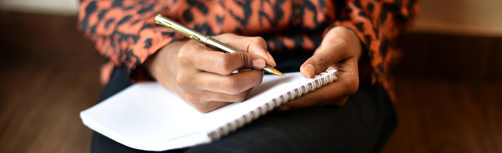 image_of_womans_hands_writing_in_notebook_GettyImages-1020523958_1540.jpg
