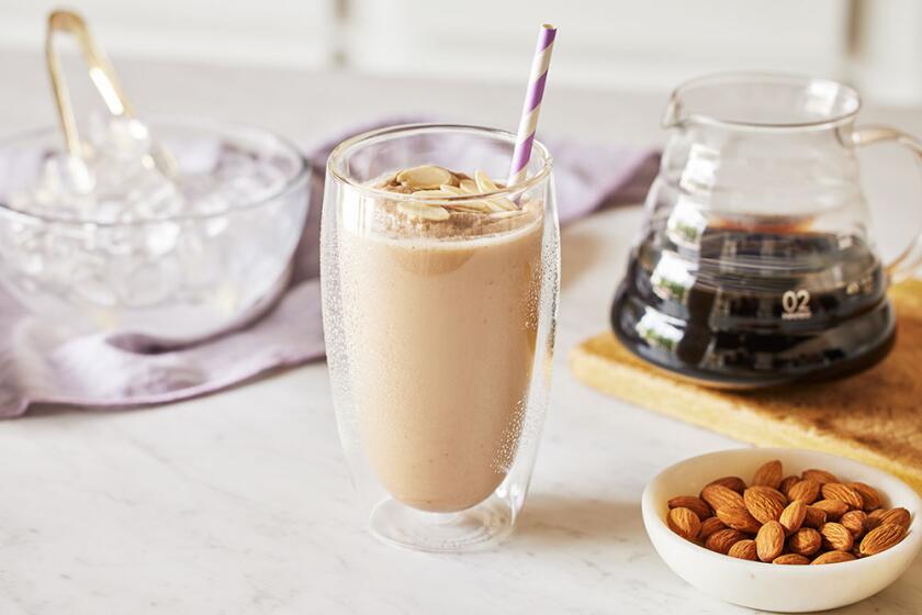 Summer smoothies styled on a white kitchen counter