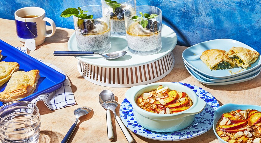 Multiple quick breakfast items on a kitchen counter with blue plates and trays