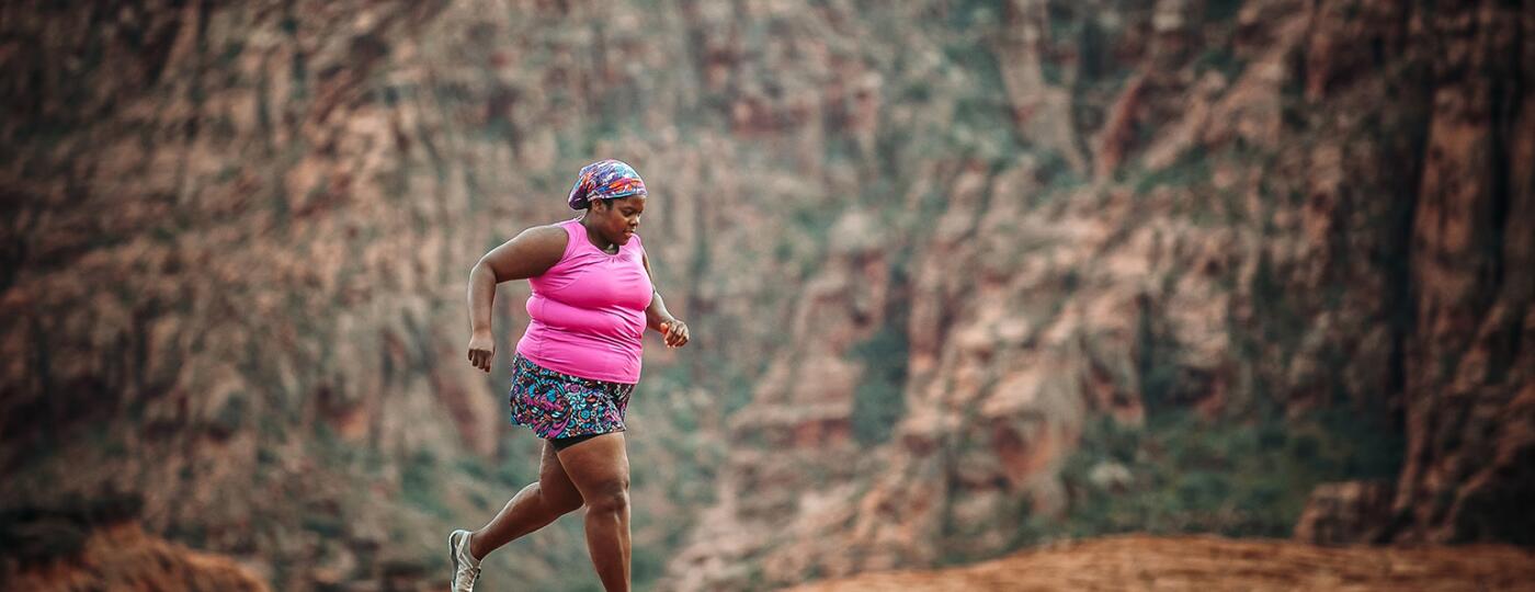 Plus size middle age woman running a marathon