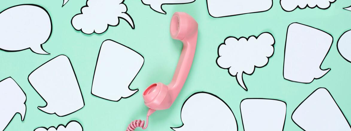 Pink phone used to stay in touch with friends surrounded by speech bubbles.