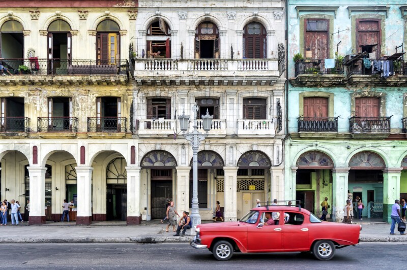 Street scene with vintage car in Havana, Cuba.