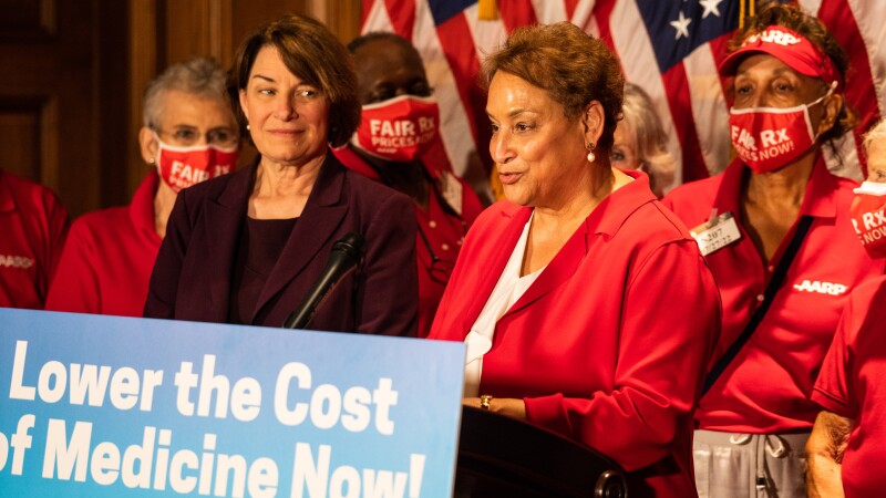 AARP CEO Jo Ann Jenkins stands beside Sen. Amy Klobuchar during a prescription drug price event on Capitol Hill on Wednesday, July 27, in Washington, D.C.