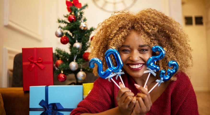 image_of_woman_holding_2023_balloons_GettyImages-1440409505_1800