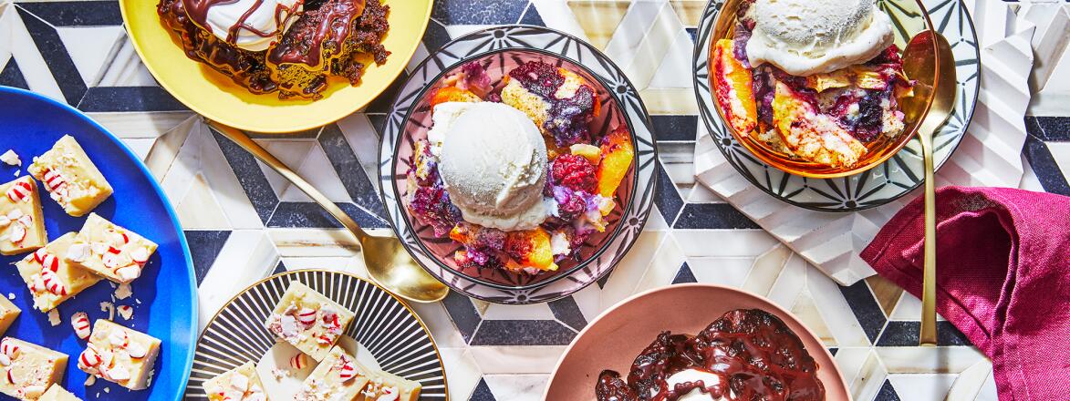 Three different amazing crock pot desserts on a tile table