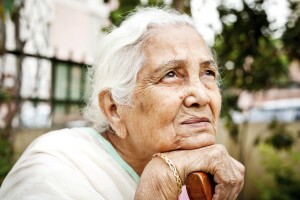 One sad pensive senior Indian woman