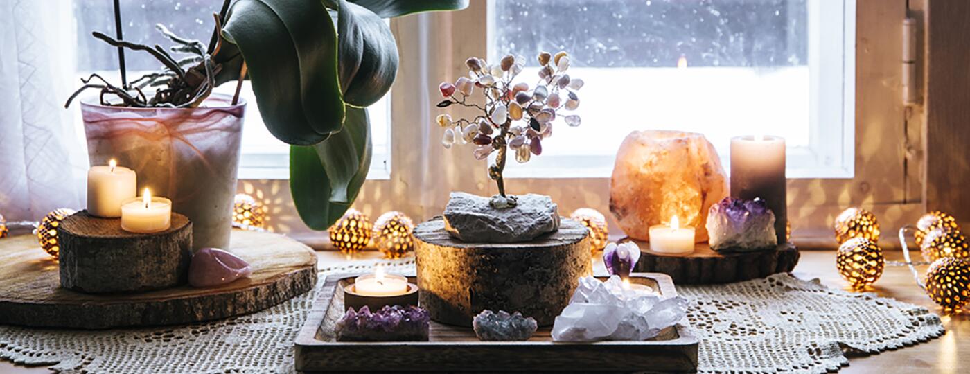 image_of_plant_candles_crystals_on_window_sill_GettyImages-1153716253_1800