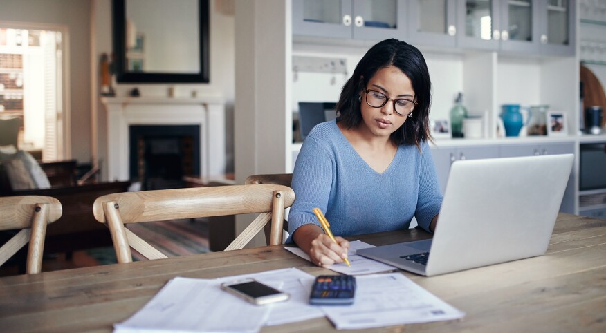 image_of_woman_working_at_desk_on_computer_GettyImages-875247416_1800