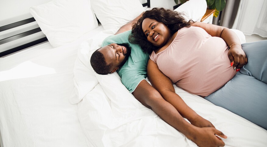 image_of_man_and_woman_laying_in_bed_GettyImages-1215132986_1800