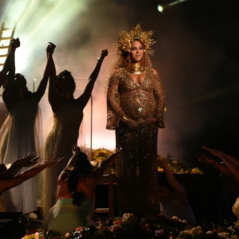 Beyoncé performing at the 59th Grammy Awards, pregnant with twins– son, Sir, and daughter, Rumi