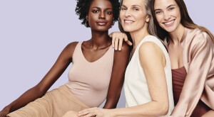 Three woman sitting for a beauty shoot
