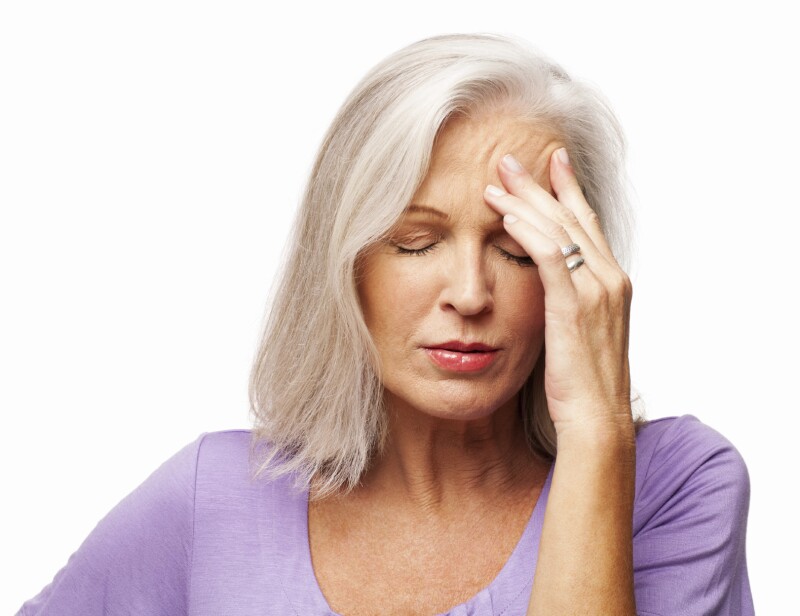 Senior Woman Suffering From Headache - Isolated