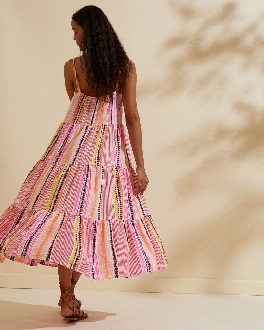 Woman in pink striped sundress