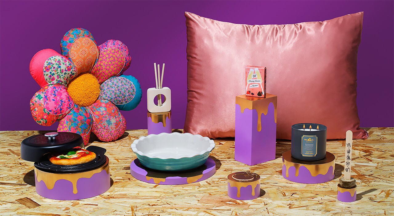 9 gifts spread across a chipboard surface with a purple background 