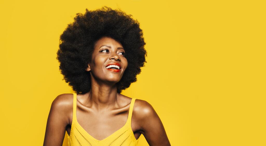 Woman smiling with healthy hair.