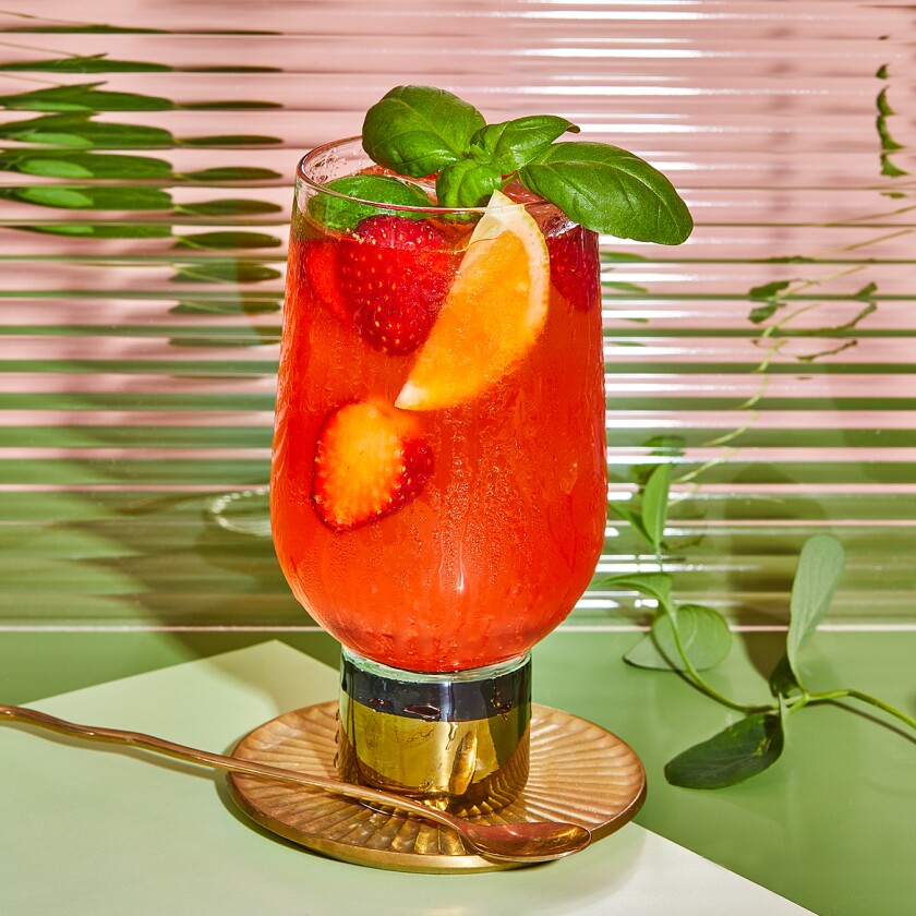 Strawberry Basil Spiked Lemonade on a green background