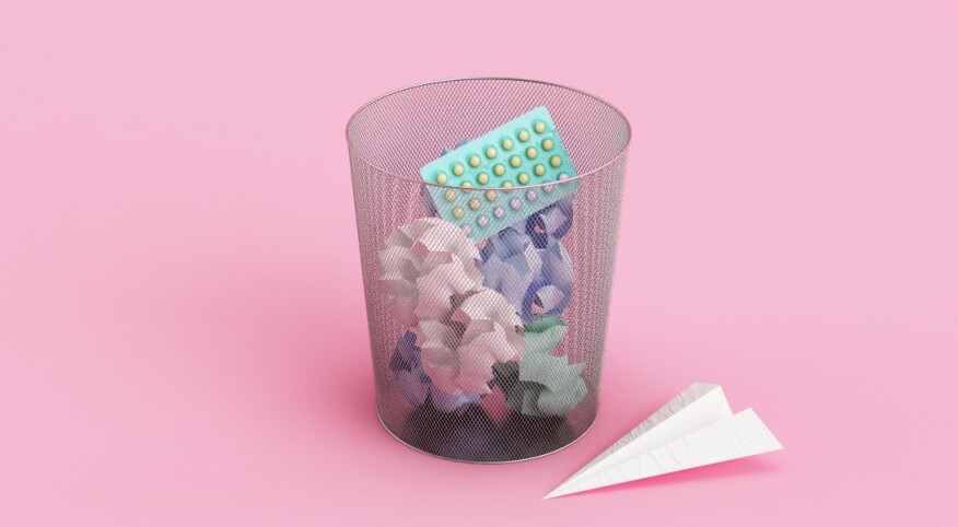 garbage can with birth control pill package in it